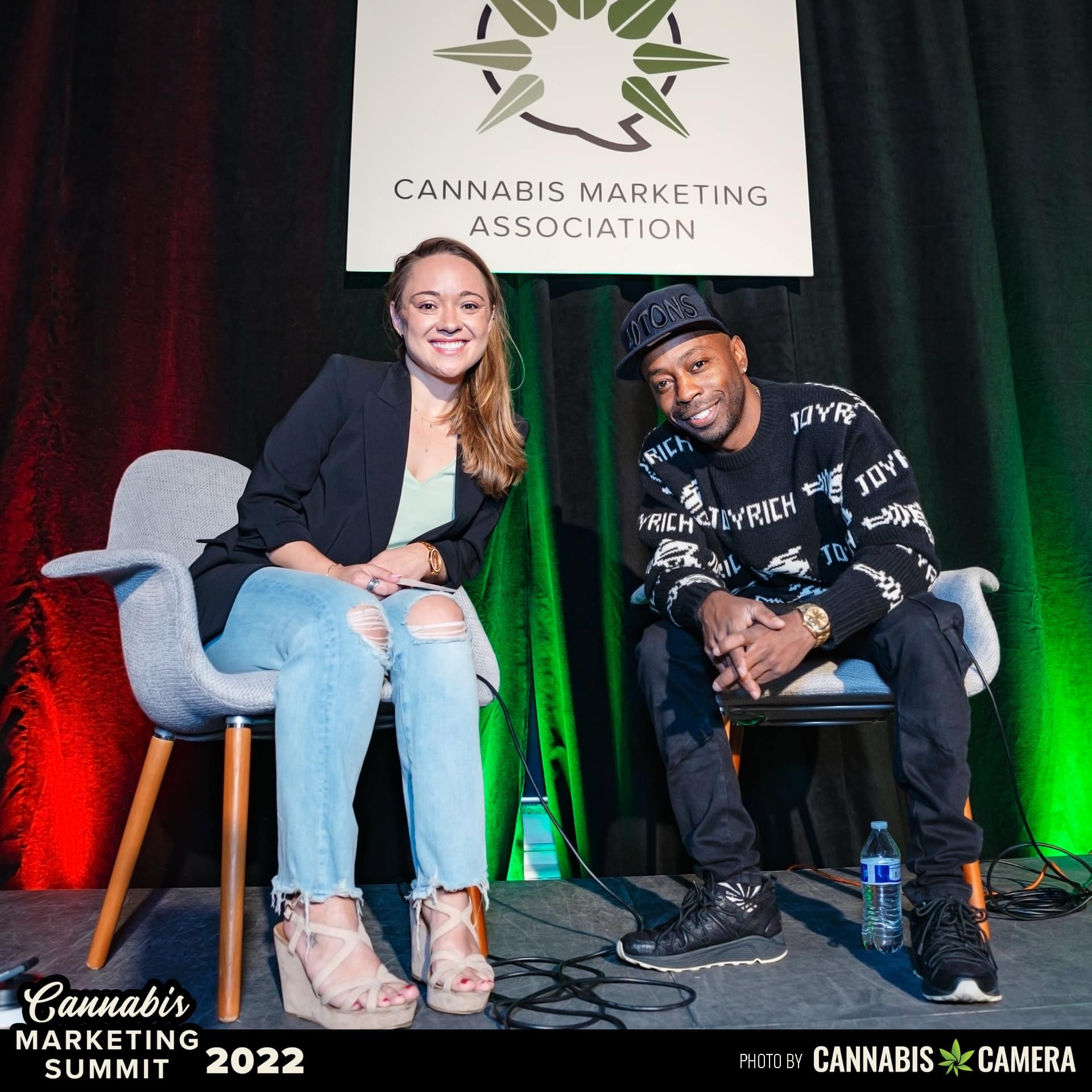 lisa and corvain on stage at the cannabis marketing summit